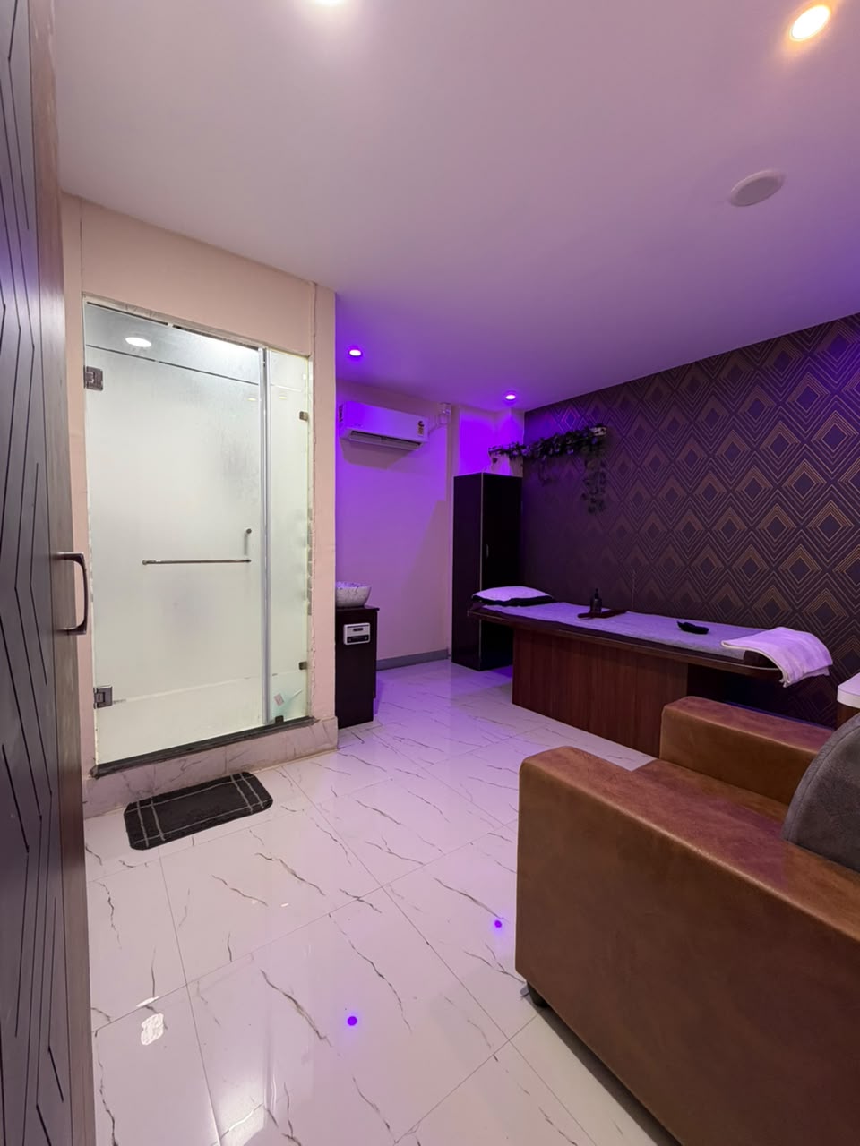 Master VIP couples suite with geometric acoustic wallpaper and attached glass shower